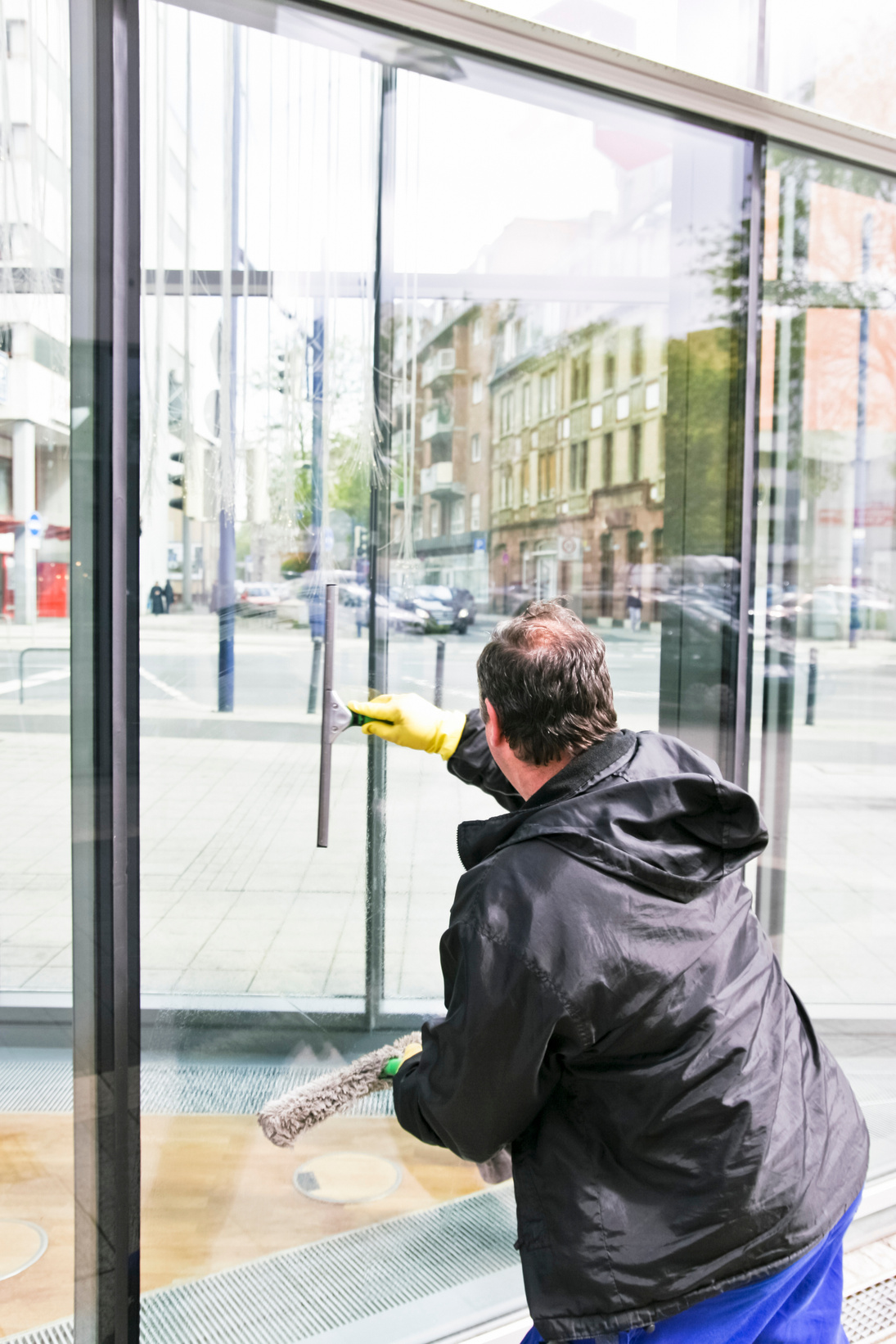 Glass Cleaner Cleaning a Glass Facade